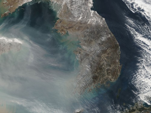 Thick smog from burning fossil fuels over China.